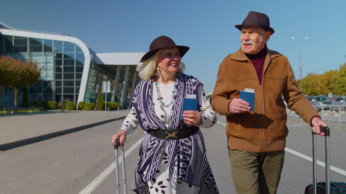 Senior tourist walking on road