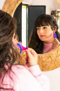 Close-up of girl looking away at home