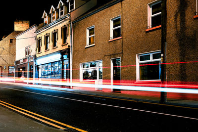 View of street and buildings at night