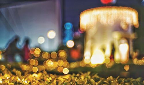 Defocused image of illuminated christmas lights at night