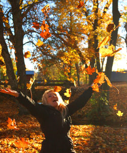 Young woman in forest during autumn