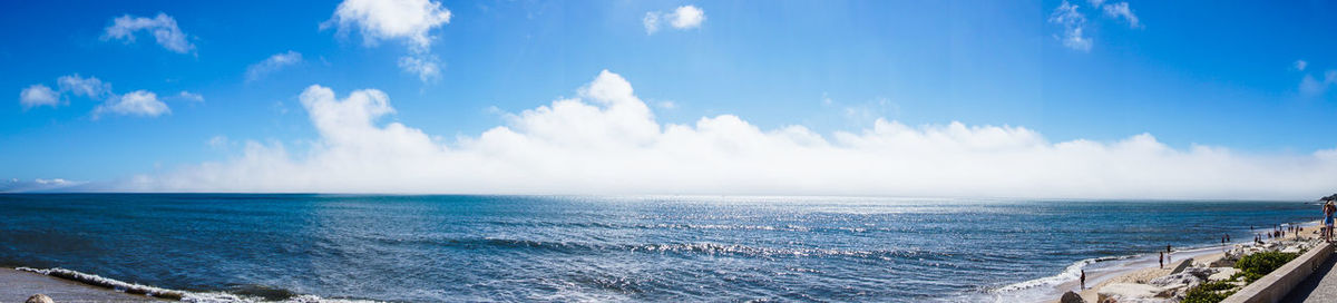 Panoramic view of sea against blue sky