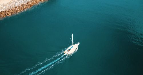 High angle view of ship sailing in sea