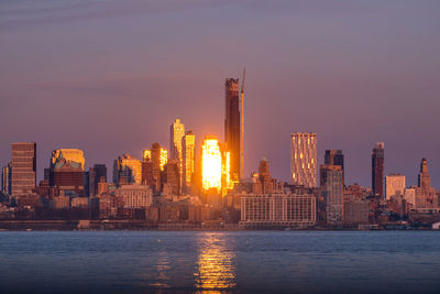 Illuminated city at waterfront