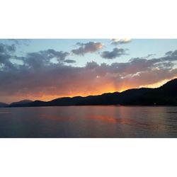 Scenic view of lake against sky during sunset