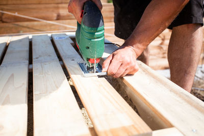 Low angle view of man working at construction site