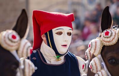 Close-up of traditional mask against trees during festival