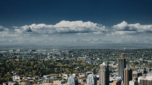 High angle view of buildings in city against sky