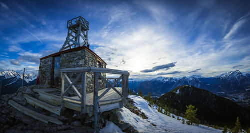 A meteorological observation station sits at the top of sanson peak in alberta canada.