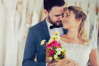 Young couple kissing on flower