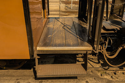 High angle view of empty chairs at railroad station