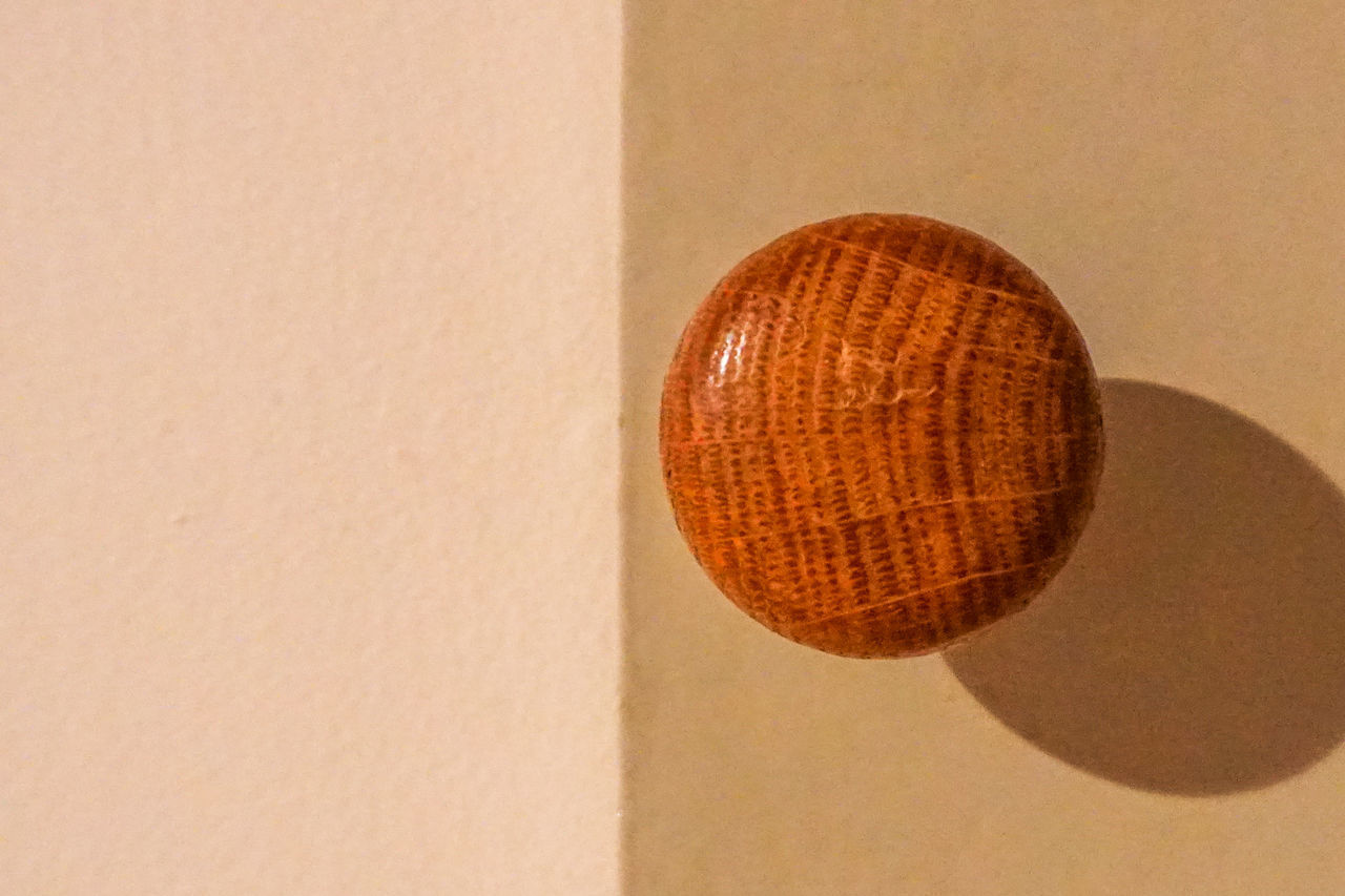 CLOSE-UP OF LAMP AGAINST WALL