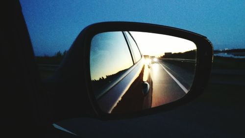 Cropped image of car on road