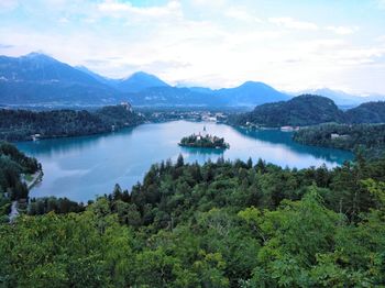 Scenic view of lake and mountains against sky