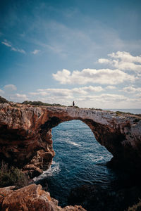 Scenic view of sea against cloudy sky