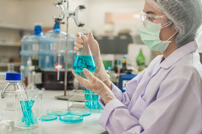 Scientist working at table in laboratory