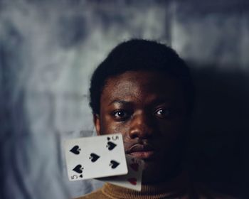 Portrait of man by cards