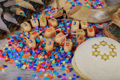 Close-up of colorful confetti on table during hanukkah