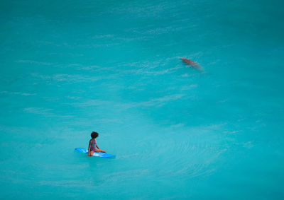 High angle view of man surfing in sea