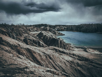 Scenic view of arid landscape against sky