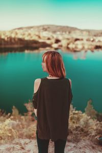 Rear view of woman looking at sea