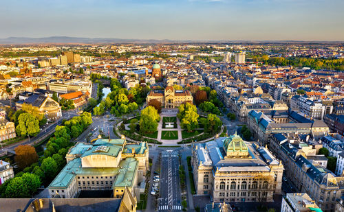 High angle view of buildings in town against sky