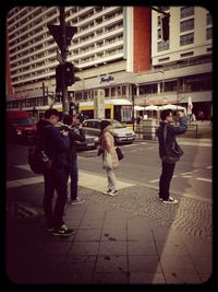 Man standing on city street