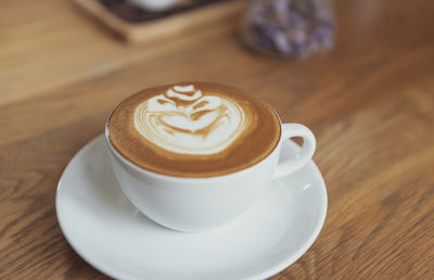 Close-up of cappuccino on table