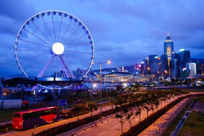 Ferris wheel in city at night