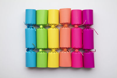 Close-up of colorful drinking straws against white background