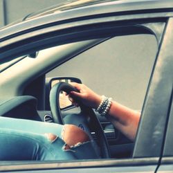 Cropped image of car on road