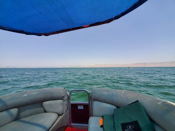 Scenic view of sea against clear blue sky