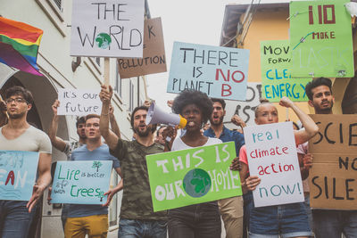 People protesting while standing on land