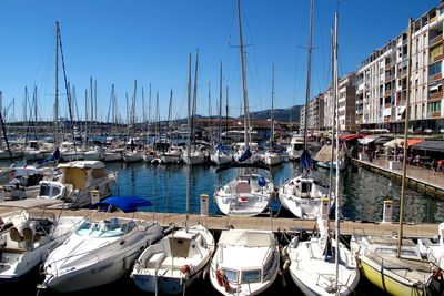 Boats moored at harbor