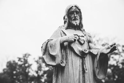 Low angle view of statue against sky