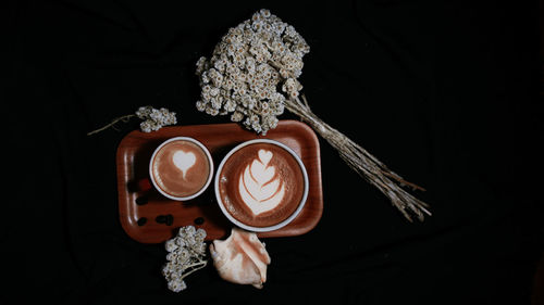 Coffee cup against black background