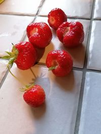 High angle view of strawberries on table