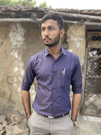 Portrait of young man standing outdoors