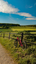 Bicycle on field against sky