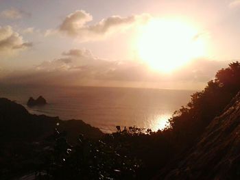 Scenic view of sea against sky at sunset