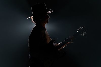 Man playing guitar on stage 