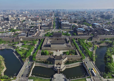 High angle view of buildings in city against sky