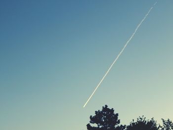 Low angle view of vapor trails in sky