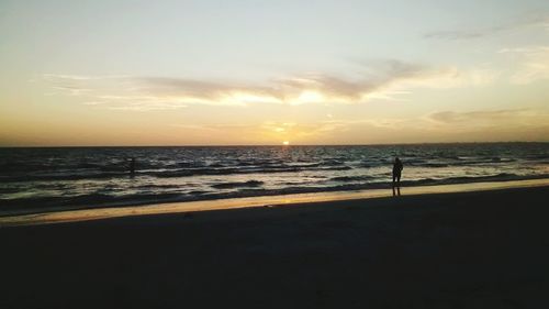 Scenic view of sea at sunset