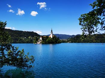 Scenic view of lake against blue sky