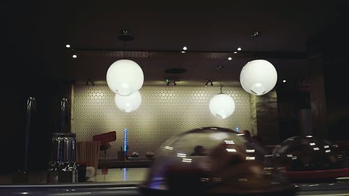 Illuminated lamp post at night