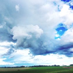 Scenic view of landscape against cloudy sky