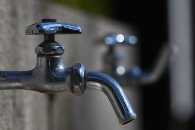 Close-up of faucet in water