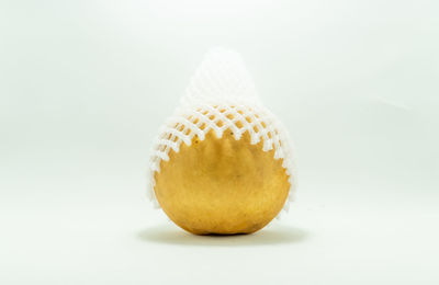 Close-up of lemon against white background