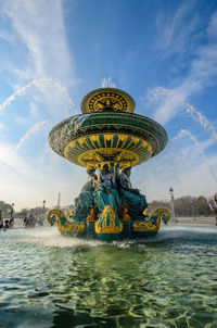 Statue of fountain against sky